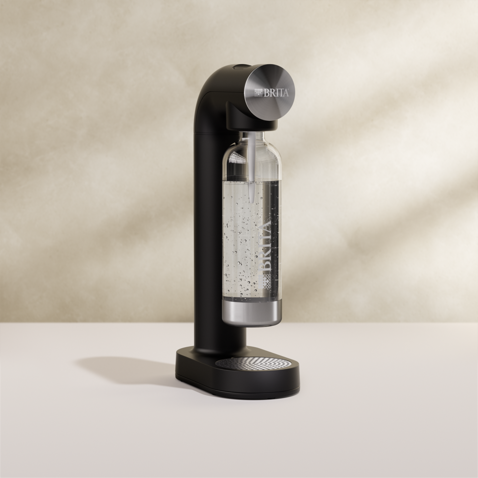 BRITA sodaONE Sparkling Water Maker in black on a beige background