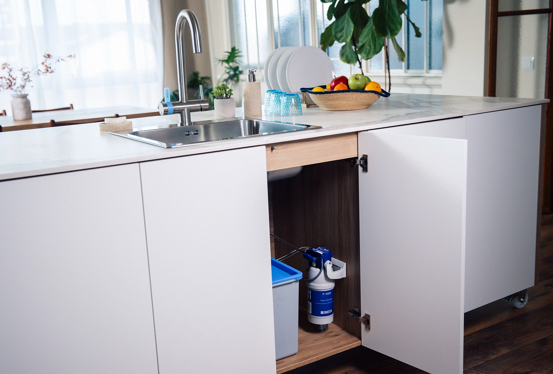 Modern kitchen with open cabinet and BRITA P 1000 water filter.